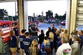 Group of Citizens Academy Members watching a presentation by Deputy Chief Grimes in the Fire Station Port